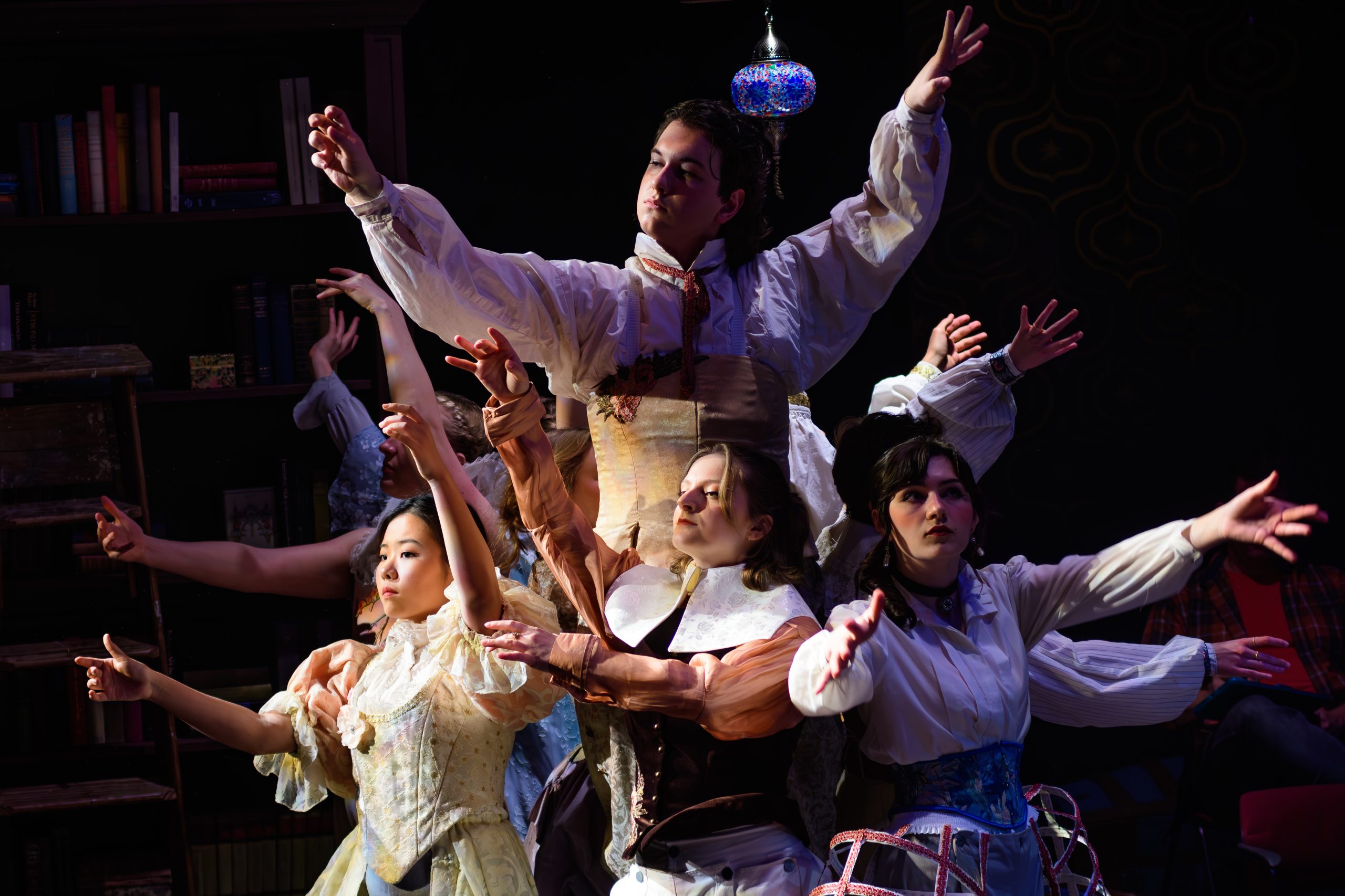 Photo from play ORLANDO of actors making a tree formation.